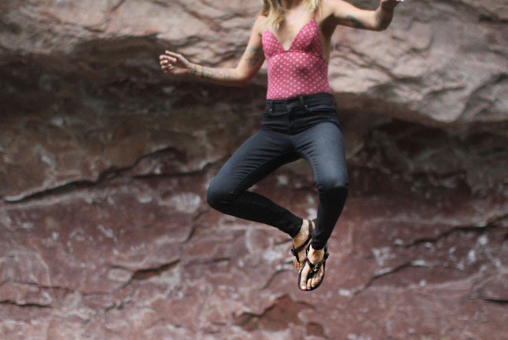 Shamma All Browns Sandals woman jumping in air