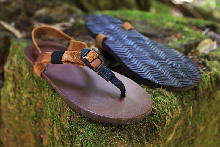 Shamma Old Goats leather sandals on mossy rocks three quarter view